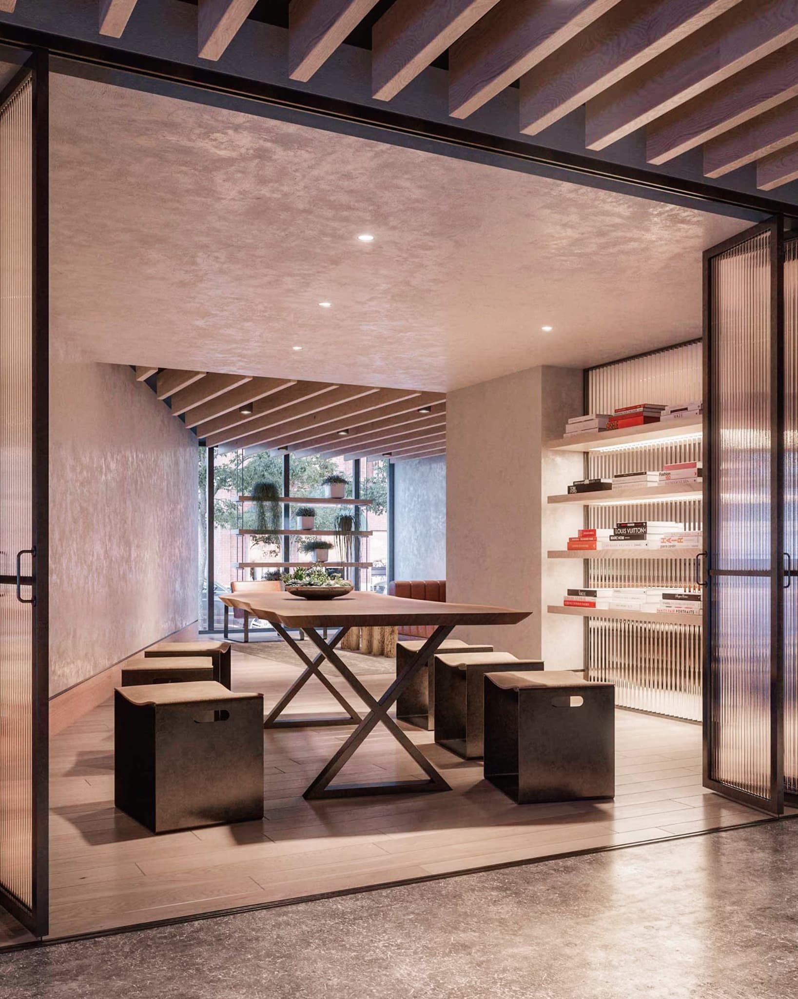 Warm contemporary interior with communal table, bookshelves, and layered architectural detailing
